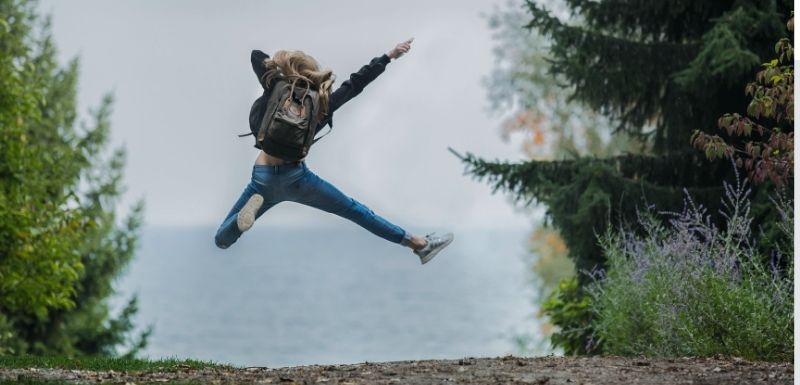 A woman jumping out of excitement